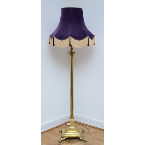 204 - A late 20th century brass standard lamp with fabric shade, in the form of a Corinthian column, acant... 