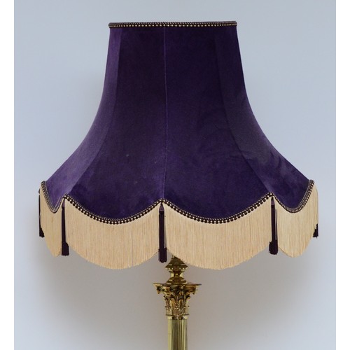 204 - A late 20th century brass standard lamp with fabric shade, in the form of a Corinthian column, acant... 