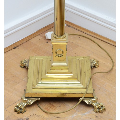 204 - A late 20th century brass standard lamp with fabric shade, in the form of a Corinthian column, acant... 