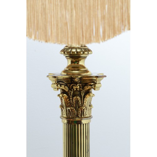 204 - A late 20th century brass standard lamp with fabric shade, in the form of a Corinthian column, acant... 