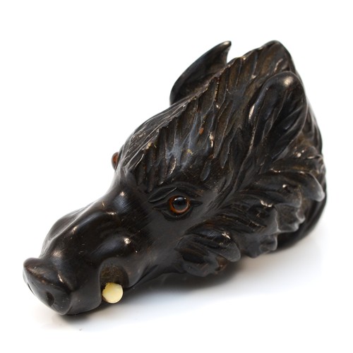 210 - A 19th century carved horn cane handle, in the form of a wild boar, with glass eyseand bone tusks, 7... 