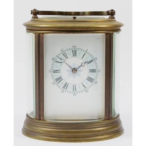 221 - An early 20th century brass case carriage clock, of oval form with painted dial and Roman numerals, ... 