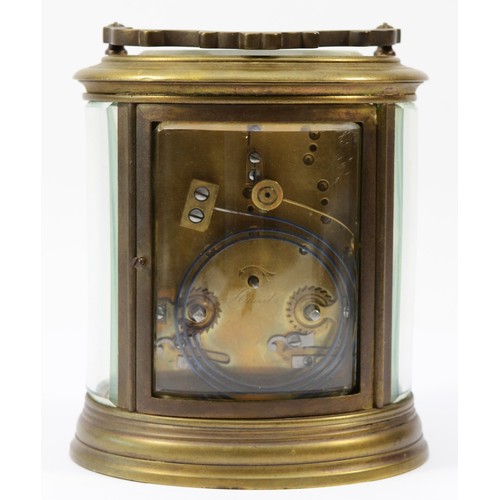 221 - An early 20th century brass case carriage clock, of oval form with painted dial and Roman numerals, ... 