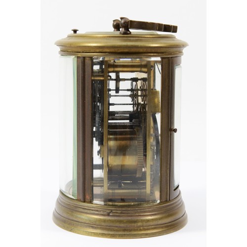 221 - An early 20th century brass case carriage clock, of oval form with painted dial and Roman numerals, ... 