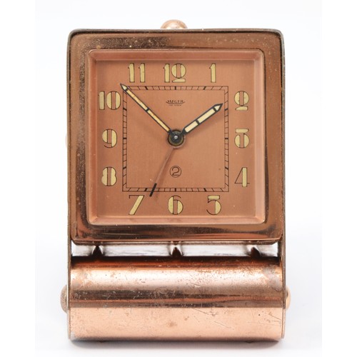 244 - A 1920s Art Deco Jaeger traveling alarm clock, plated copper folding case, the dial stamped Jaeger F... 