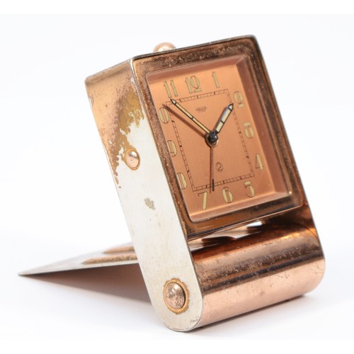 244 - A 1920s Art Deco Jaeger traveling alarm clock, plated copper folding case, the dial stamped Jaeger F... 