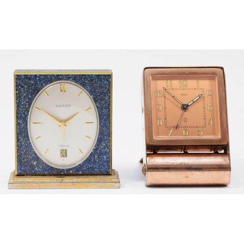 244 - A 1920s Art Deco Jaeger traveling alarm clock, plated copper folding case, the dial stamped Jaeger F... 