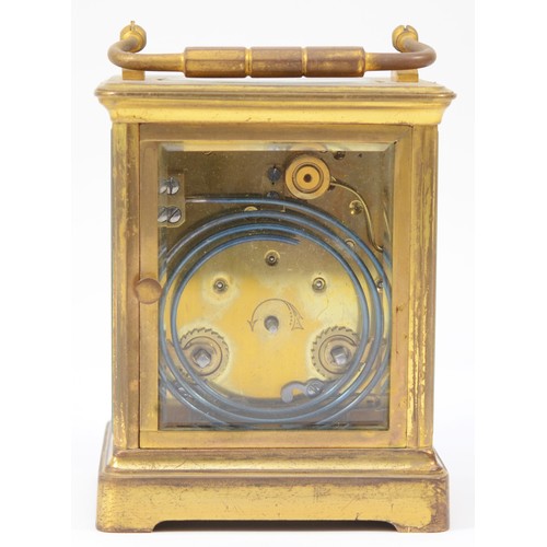 224 - An early 20th century French brass case carriage clock, having white enamelled dial with Roman numer... 