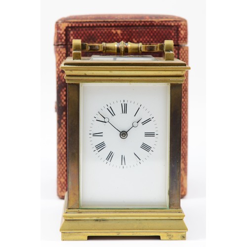 228 - An early 20th century brass case 8 day carriage clock, the movement striking on gong, raised on a br... 