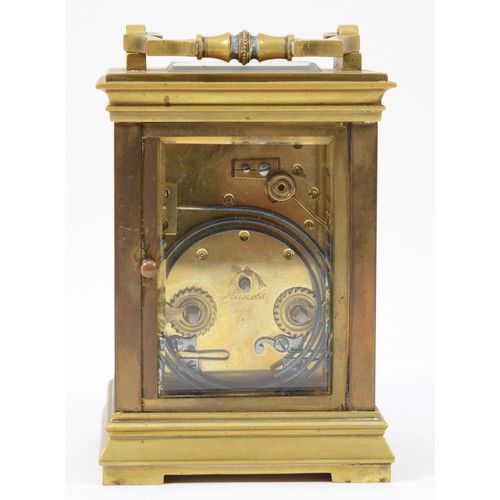 228 - An early 20th century brass case 8 day carriage clock, the movement striking on gong, raised on a br... 