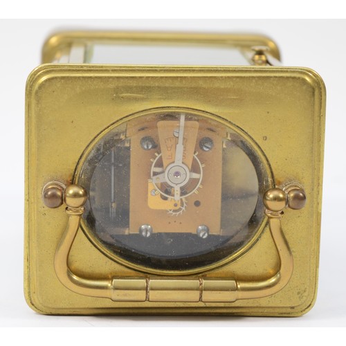 230 - An early 20th century brass case carriage clock, having enamelled dial with Roman numerals, the 8 da... 