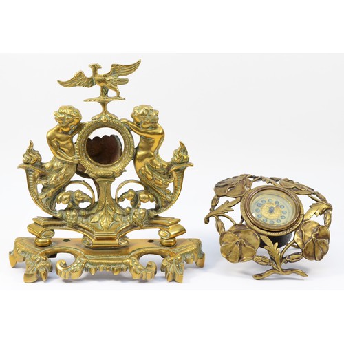 251 - A late 19th Century brass desk top pocket watch stand, comprising of laurel wreath with scrolls and ... 