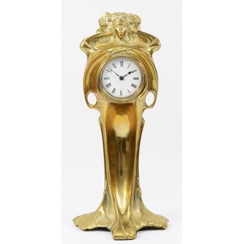 248 - An Art Nouveau gilt brass 8 day mantel clock, in the form of a cloaked female figure holding a clock... 