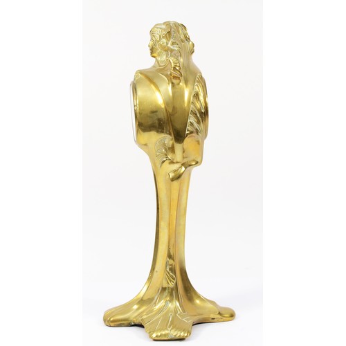 248 - An Art Nouveau gilt brass 8 day mantel clock, in the form of a cloaked female figure holding a clock... 