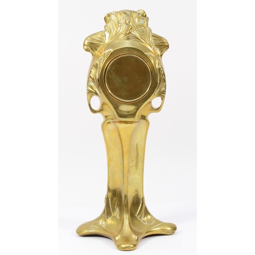 248 - An Art Nouveau gilt brass 8 day mantel clock, in the form of a cloaked female figure holding a clock... 