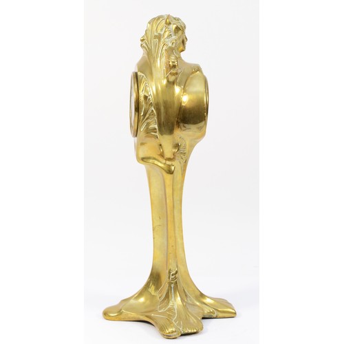 248 - An Art Nouveau gilt brass 8 day mantel clock, in the form of a cloaked female figure holding a clock... 