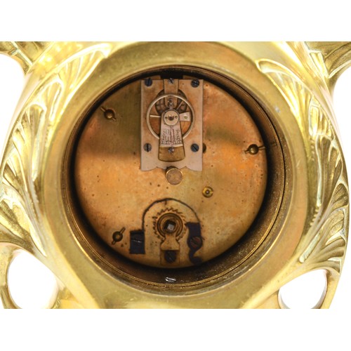 248 - An Art Nouveau gilt brass 8 day mantel clock, in the form of a cloaked female figure holding a clock... 