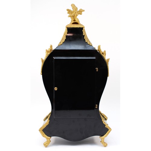 261 - A 20th century eight day mantel clock, the painted and ebonised case with simulated floral inlay and... 