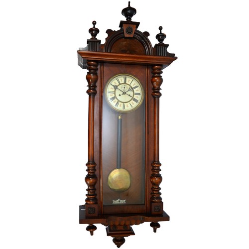 266 - A late 19th century mahogany cased Vienna style wall clock, with arched pediment and turned finales ... 