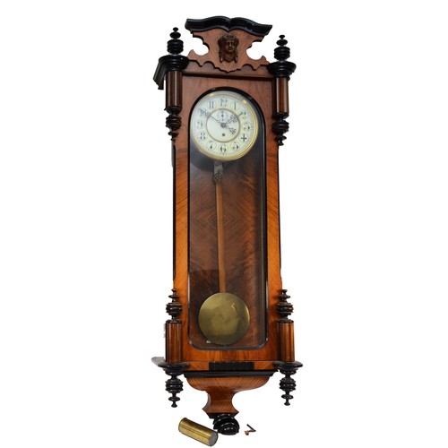 268 - A late 19th century walnut and ebonised Vienna style wall clock, with carved pediment and finials, f... 