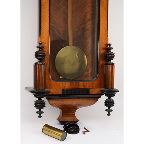 268 - A late 19th century walnut and ebonised Vienna style wall clock, with carved pediment and finials, f... 