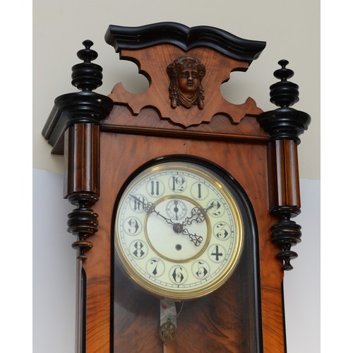 268 - A late 19th century walnut and ebonised Vienna style wall clock, with carved pediment and finials, f... 