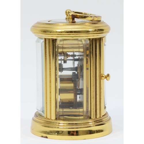 233 - A miniature brass case carriage clock, circa 20th century, of oval form having a French 8 day moveme... 