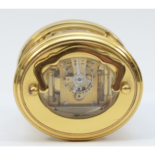 233 - A miniature brass case carriage clock, circa 20th century, of oval form having a French 8 day moveme... 