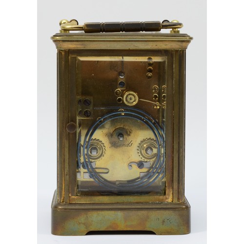 234 - An early 20th century brass case carriage clock, the enamelled dial with Roman and Arabic numerals, ... 