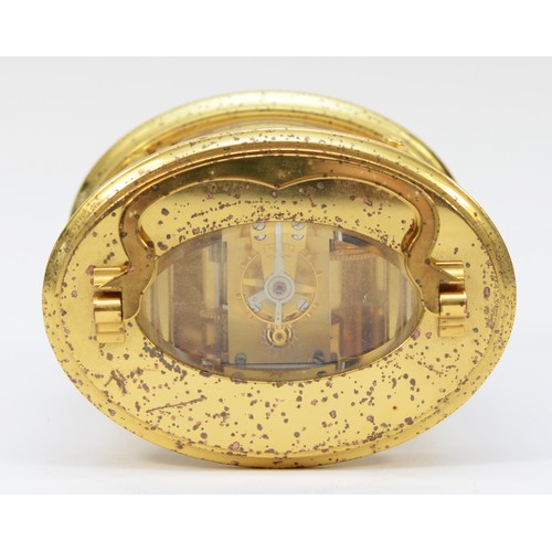 235 - A 20th century English oval brass case carriage clock, the white enamelled dial with Roman numerals,... 