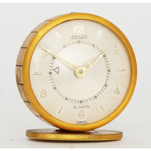 250 - Jaeger, a gilt metal 8  day travel alarm clock, model 51, mounted on a stand, with original 1956 rec... 