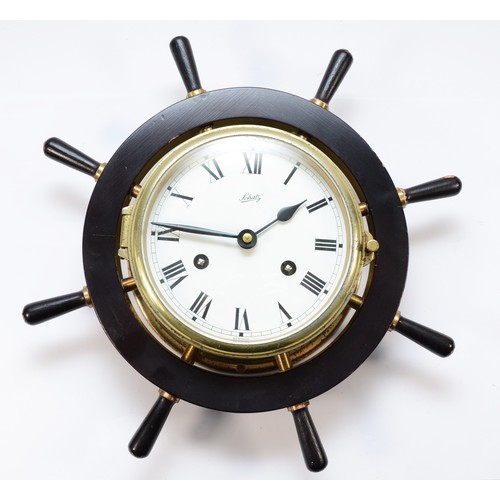 255 - A Schatz German brass bulkhead ships clock, the painted dial with Roman numerals, housing an 8 day s... 