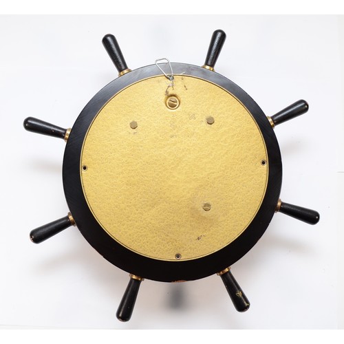 255 - A Schatz German brass bulkhead ships clock, the painted dial with Roman numerals, housing an 8 day s... 