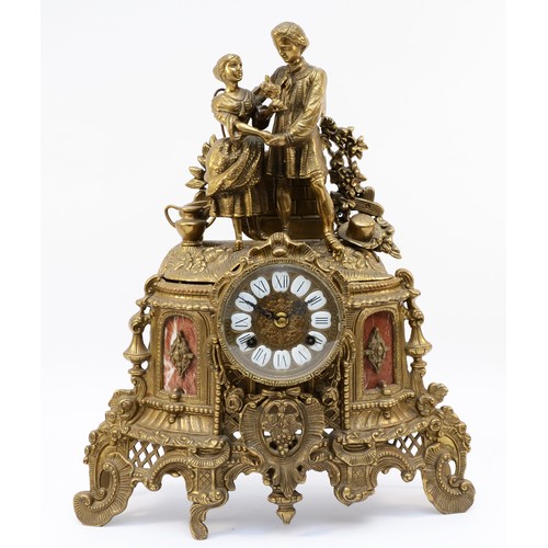 265 - A 20th century Italian Imperial style gilt cast brass mantel clock, two lovers above scrolling decor... 