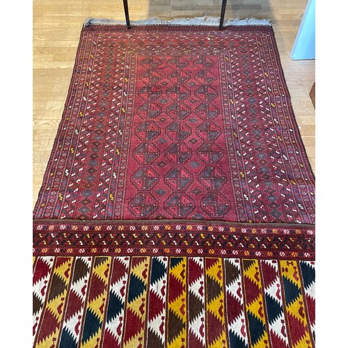 214 - An early 20th century Persian shiraz rug, hand woven kilim cotton having deep border with aztec patt... 