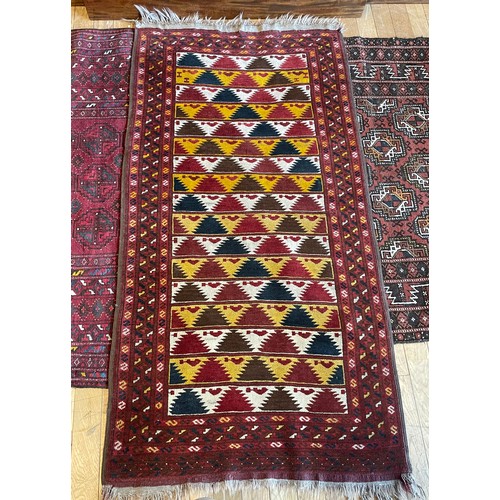 214 - An early 20th century Persian shiraz rug, hand woven kilim cotton having deep border with aztec patt... 