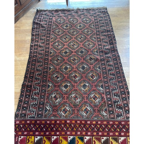 214 - An early 20th century Persian shiraz rug, hand woven kilim cotton having deep border with aztec patt... 