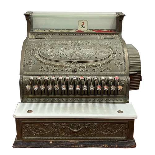 Early 20th century National Cash Register by the National Cash Register Co., Dayton, Ohio, USA, of typical form with nickel-plated ornate cast brass body, hinged cover, oak stand base, Size Number 36 1/4 - Factory Number 536988.
