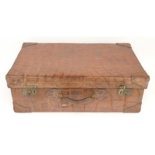 218 - A large reptile skin suitcase, late 19th early 20th century.
66x41cm.