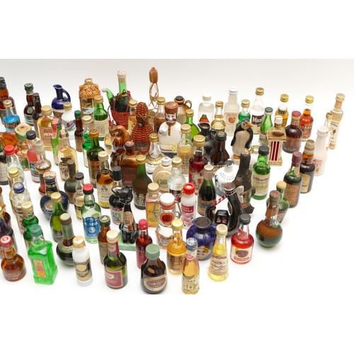 302 - A large quantity of alcohol miniatures to include Gilbeys gin, Pickwick Scotch whisky, Leg Bender- C... 