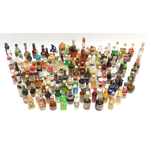 302 - A large quantity of alcohol miniatures to include Gilbeys gin, Pickwick Scotch whisky, Leg Bender- C... 