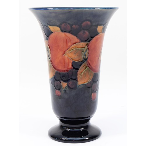 323 - A large Moorcroft pomegranate pattern vase c.1920s, of flared form, tubelined and hand-painted in re... 