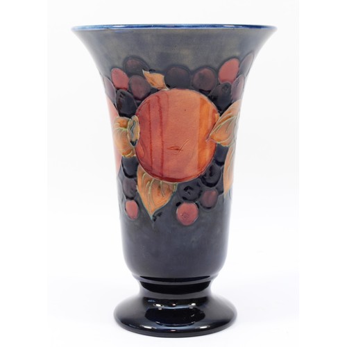 323 - A large Moorcroft pomegranate pattern vase c.1920s, of flared form, tubelined and hand-painted in re... 