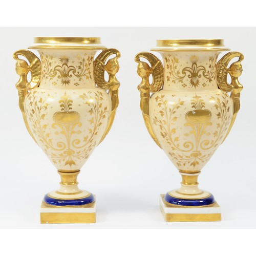 328 - A pair of 19th century English porcelain vases, each painted with floral bouquet within a gilt overl... 