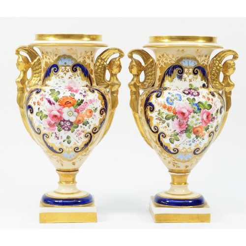 328 - A pair of 19th century English porcelain vases, each painted with floral bouquet within a gilt overl... 