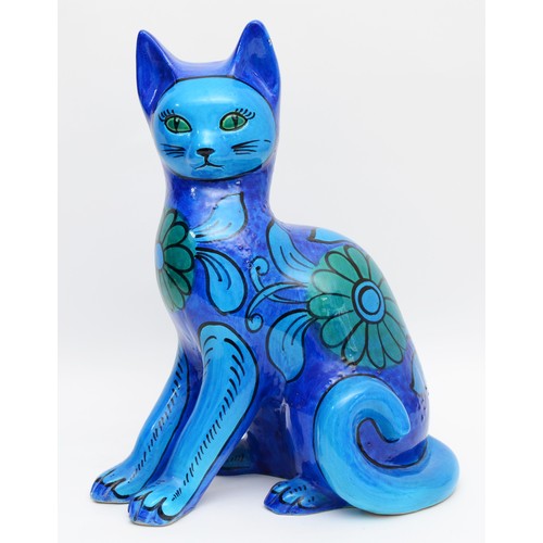 334 - A large 1960s Mario Bellini ceramic sculpture of a seated cat, having painted turquoise and blue flo... 