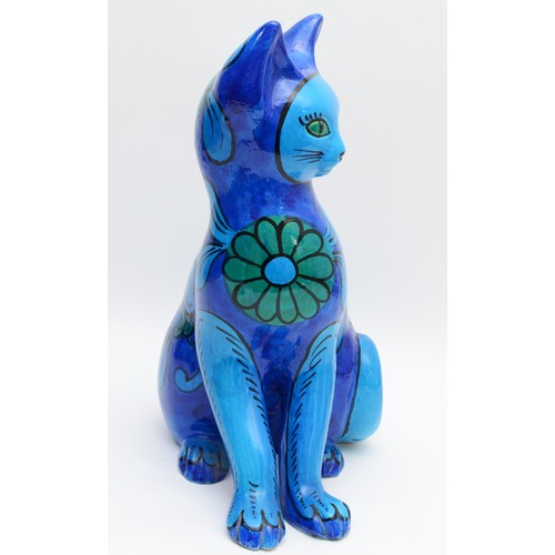 334 - A large 1960s Mario Bellini ceramic sculpture of a seated cat, having painted turquoise and blue flo... 