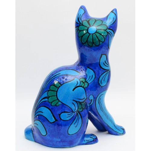 334 - A large 1960s Mario Bellini ceramic sculpture of a seated cat, having painted turquoise and blue flo... 