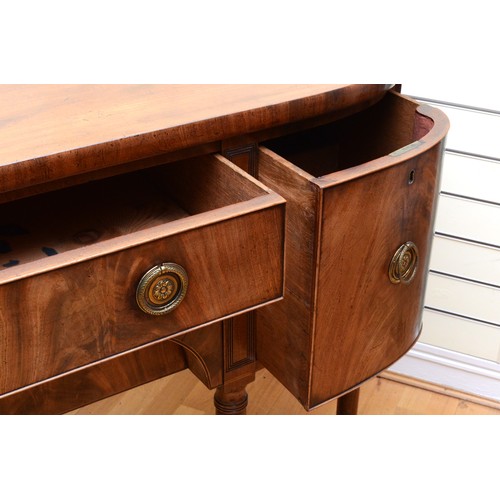 355 - A late Victorian Hepplewhite style mahogany sideboard, the two bow fronted cupboards flanking two re... 