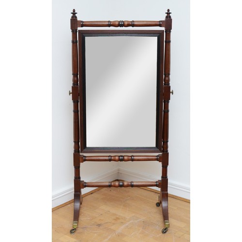 357 - A Victorian mahogany cheval mirror, pierced and carved shell pediment with extending scrolling folia... 